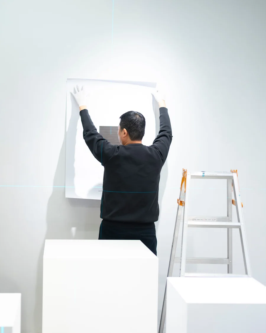 An artwork being installed in a gallery in Shinjuku, Tokyo